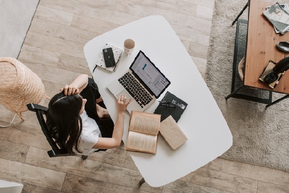 A woman sitting behind an office desk..