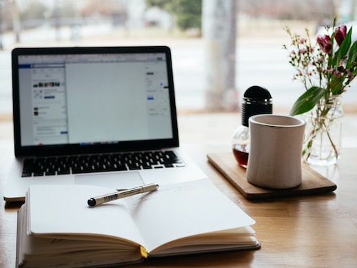 Computer on a desk looking a lifestyle Management Services