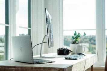 white office with a computer on the desk
