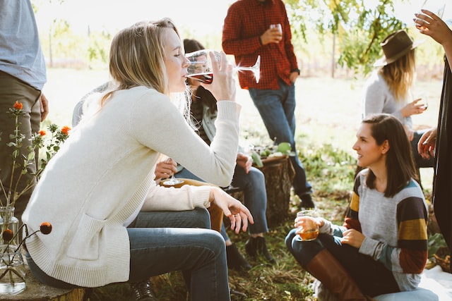 people drinking getting ready to play a card game