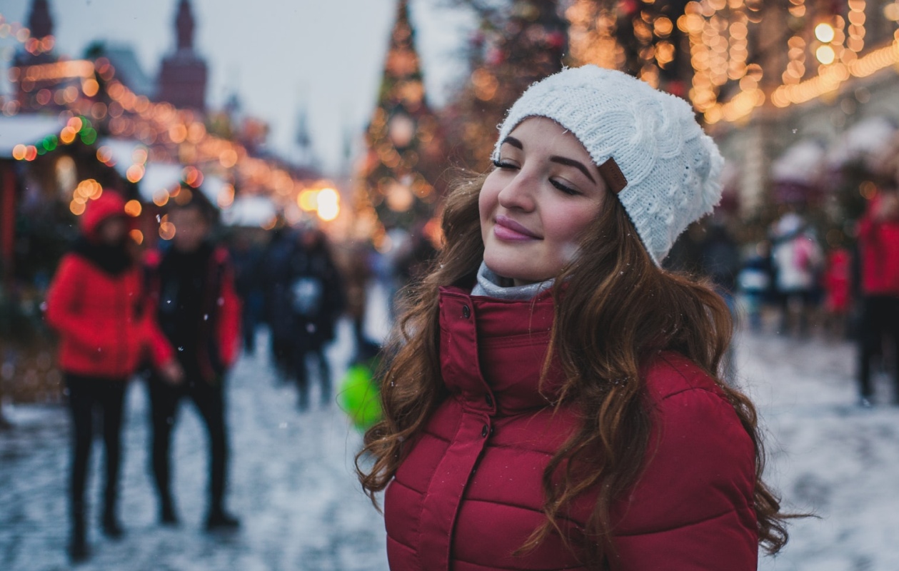 A woman during the holidays with Holiday Hair Magic